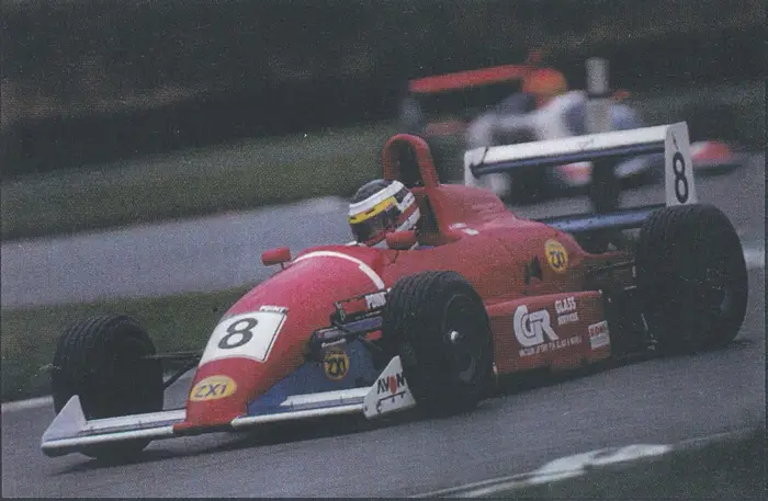 Team ZX1 history with Formula racing car sponsored by ZX1 lubricants, advancing motorsport technology.